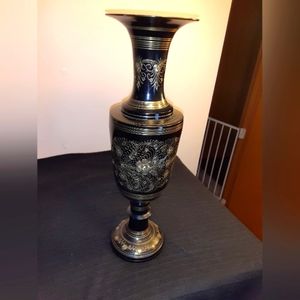 Black metal vase with gold trim